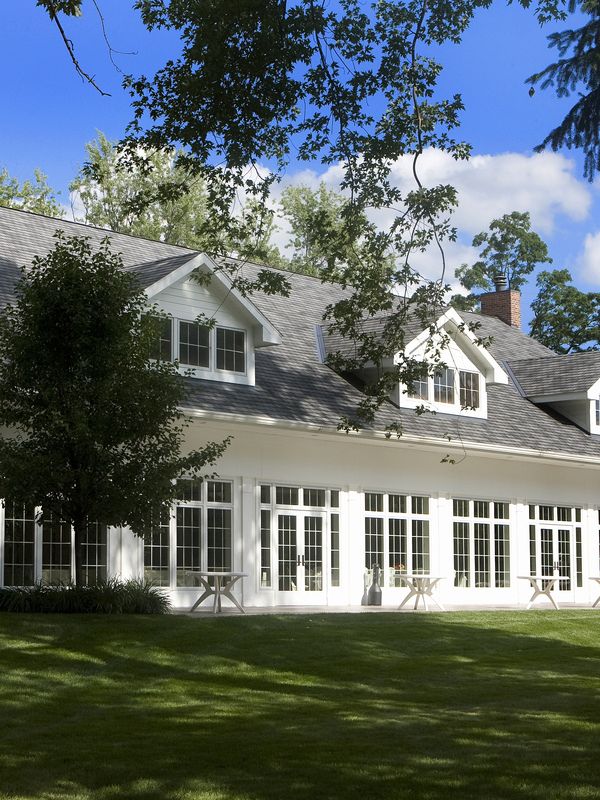 The manor house at River Stone seen across its lawn