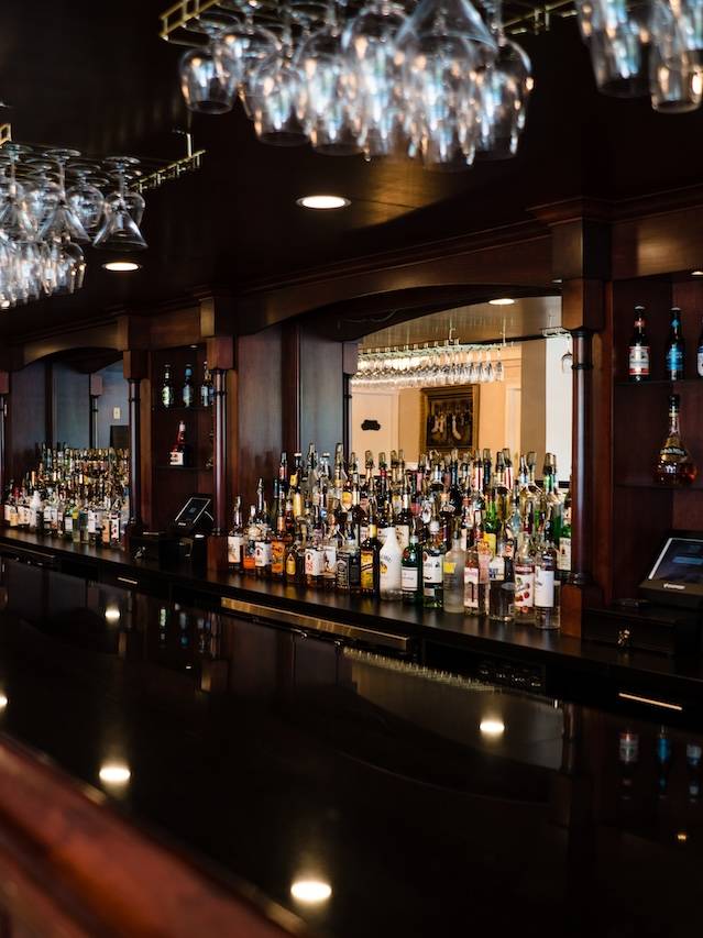 The thirty-five foot oak bar in the cocktail room at Grand View