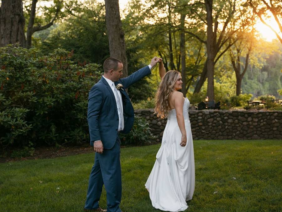 Elena and Max on the lawn at River Stone Manor